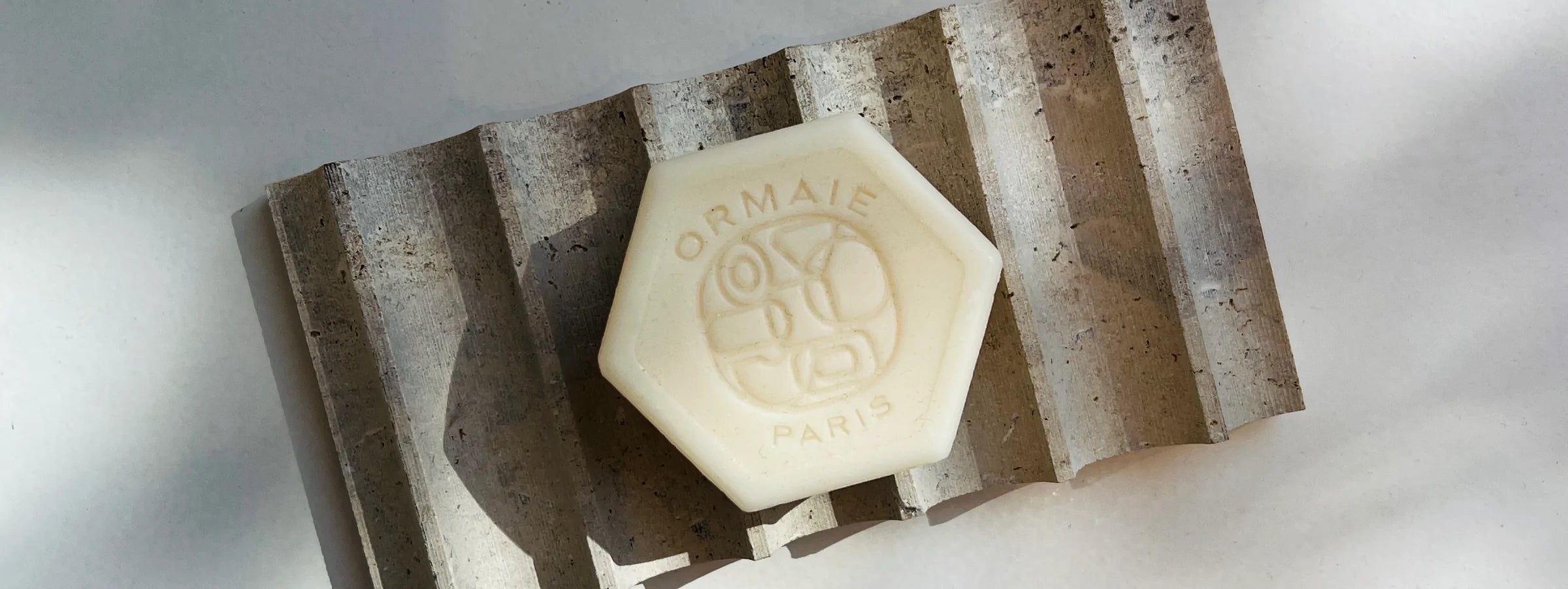 Ormaie Sandalwood Soaps on Travertine