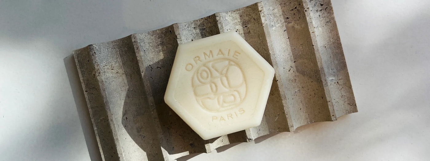 Ormaie Sandalwood Soaps on Travertine 