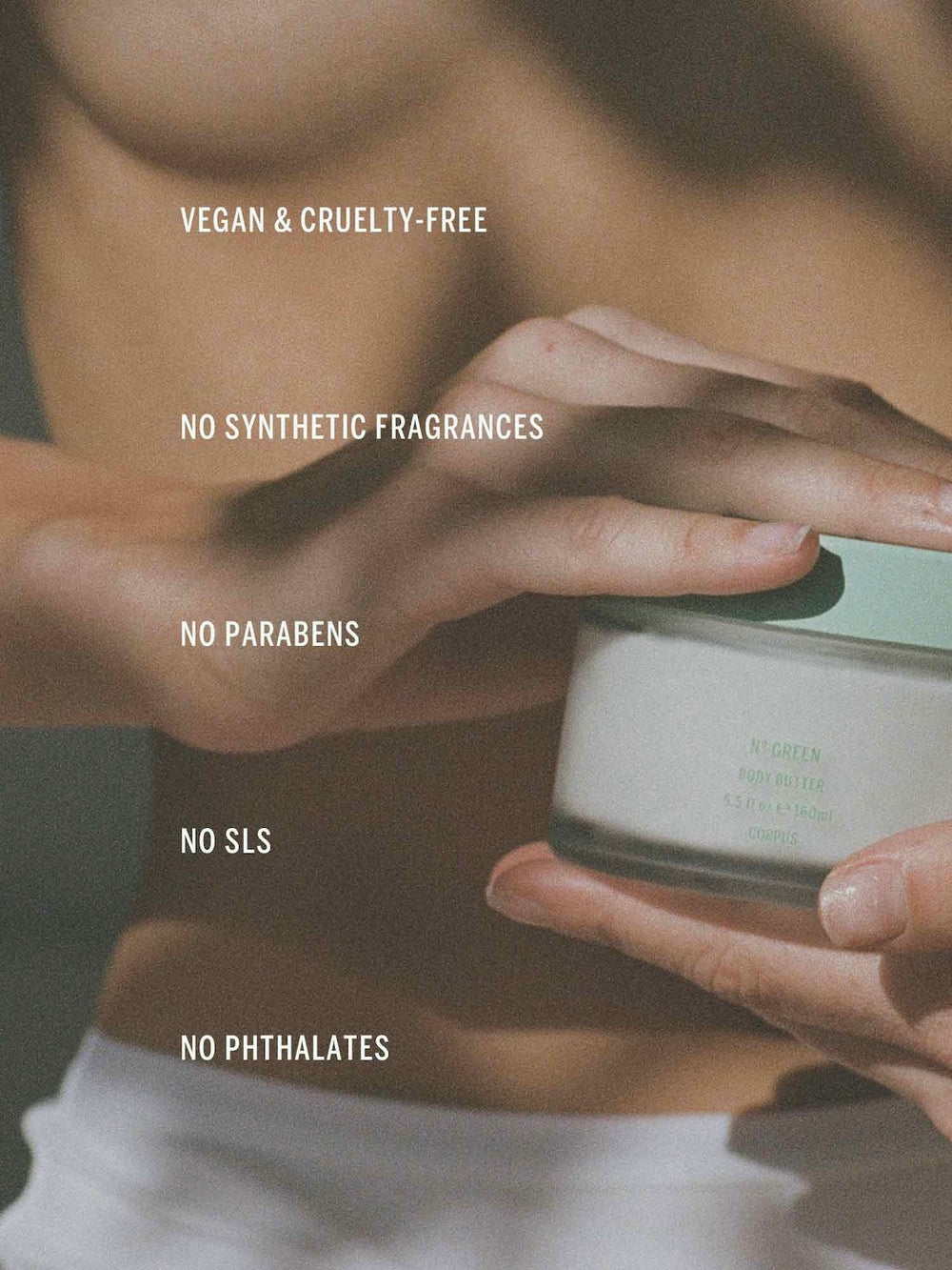 Person holding a skincare product with text highlighting vegan, cruelty-free, and chemical-free attributes.