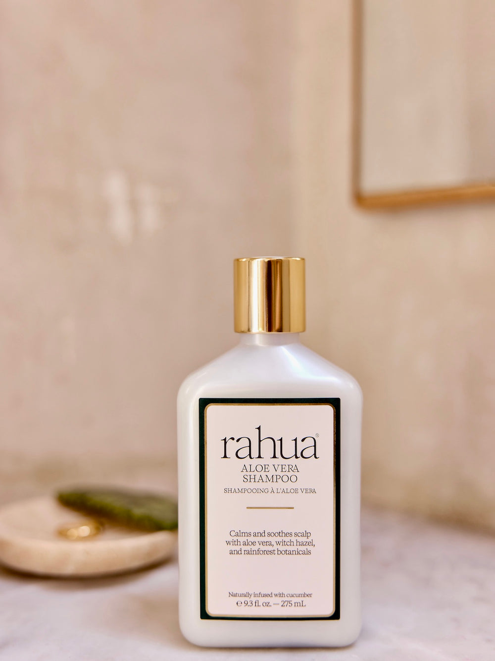 Bottle of Rahua Aloe Vera Shampoo on a neutral background