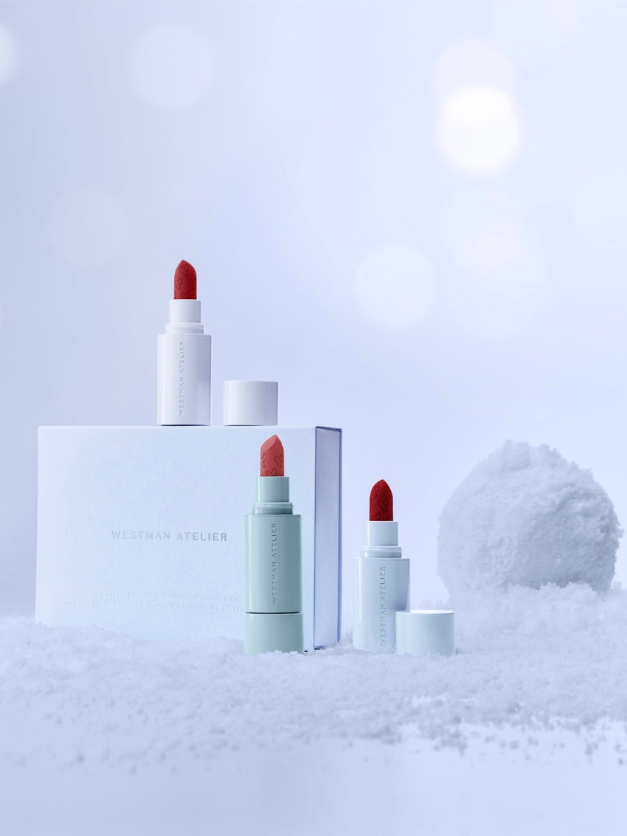 Three lipsticks with red caps on a white background. Petite Lip Suede Matte Lipstick Trio