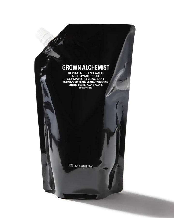 Black pouch with 'Grown Alchemist' branding on a white background