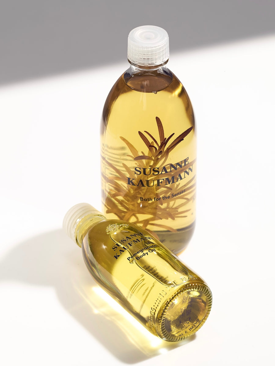 Two bottles of Susanne Kaufmann product on a light background