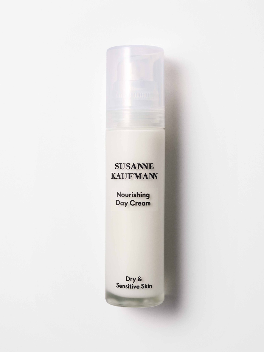 Skincare bottle labeled 'Susanne Kaufmann Nourishing Day Cream' on a white background